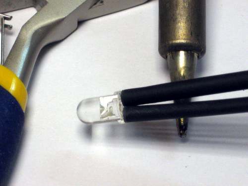 Shrinking heat shrink over LED wires